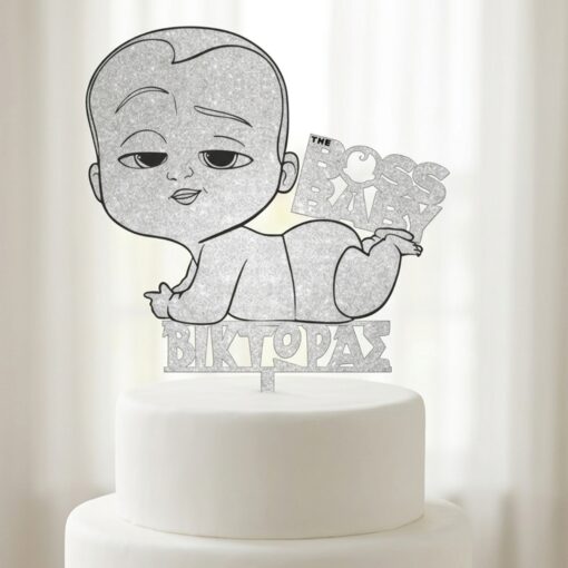 Cake topper με τη φιγούρα του Baby Boss και χαραγμένο το όνομα "Βίκτωρας" από ασημί glitter ξύλο.